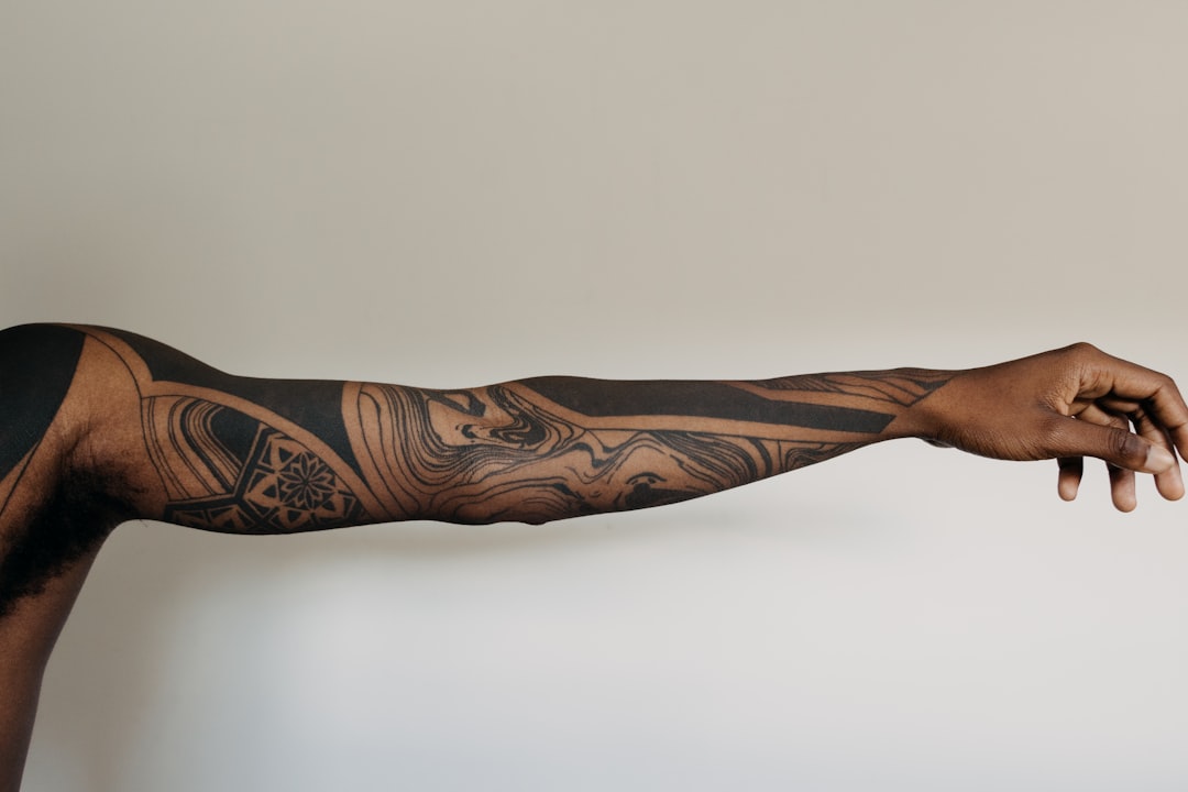 black-and-brown-tribal-tattoo-lejves-wiic